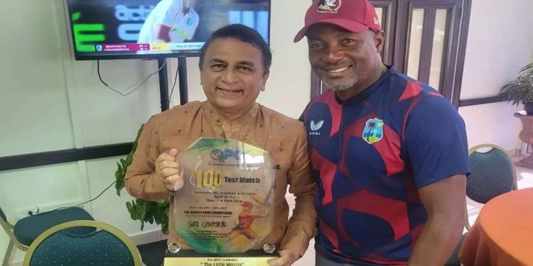 At Queen's Park Cricket Club, Sunil Gavaskar is honored by West Indies legend Brian Lara.