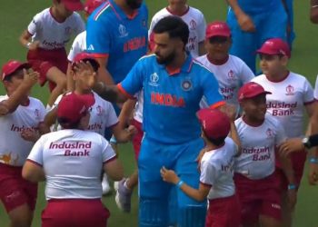 Before India's match against South Africa in 2023, children swarm Virat Kohli with birthday greetings.