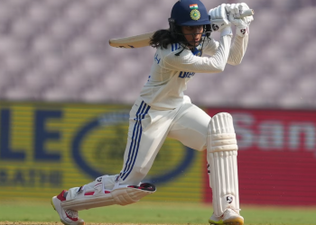 Following their historic victory over Australia, Jemimah Rodrigues celebrates with her teammates and support staff.