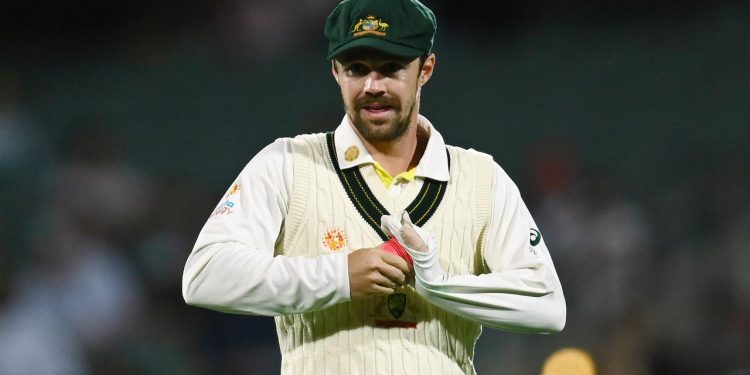 Travis Head's arrival in Brisbane has been postponed due to a positive COVID-19 test.