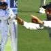 Virat Kohli motions for the players to bow down and urges them not to celebrate Dean Elgar wicket.