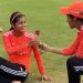 Shreyanka Patil receives a rose from Jemimah Rodrigues, dubbed the "most exciting upcoming player."