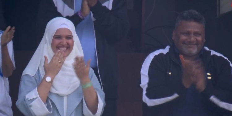 Sarfaraz Khan's wife and father celebrate his first half-century milestone by blowing kisses during the IND vs. ENG game.