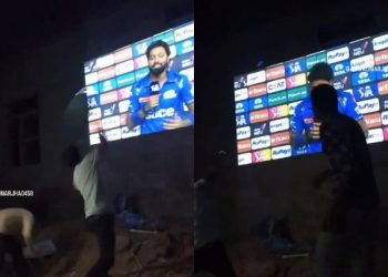 IPL 2024: As Hardik Pandya receives a post-match interview, fans toss bottles and shoes onto a big screen.