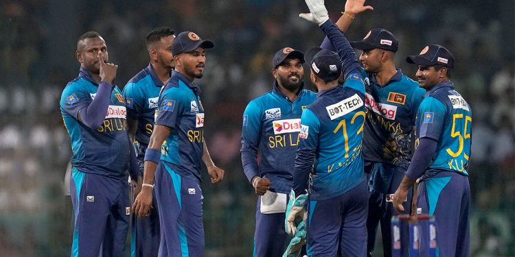 Weightlifter Ransilu Jayathilake of Sri Lanka pokes fun at Hasaranga & Co